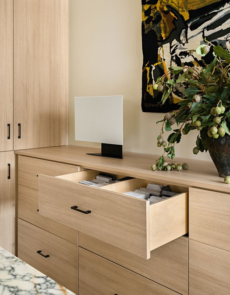 Custom drawer storage for Jeremiah Brent's personal office and work space in light wood finish created by California Closets