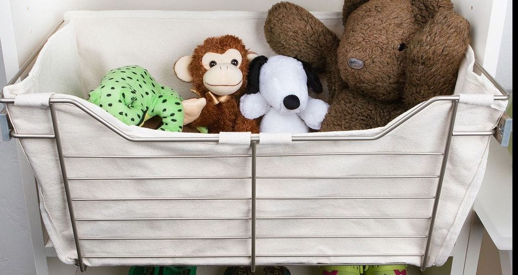 Custom toy organizer basket with canvas basket in black wire frame designed by California Closets
