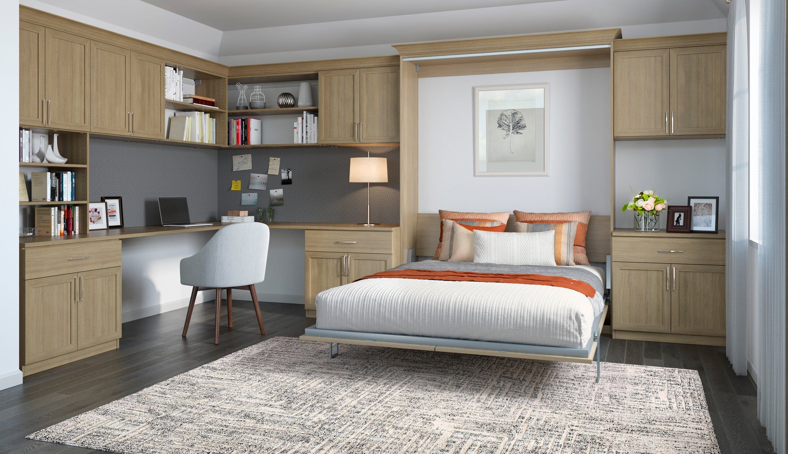 Storage cabinets, built in desk and Murphy bed created in one room by California Closets